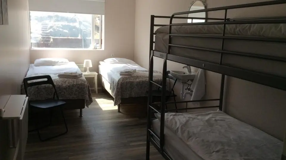 Quadruple Room with Mountain View at Við Hafið Oceanfront Guesthouse